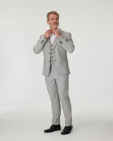 Man wearing a gray checkered suit with a white shirt on a white background
